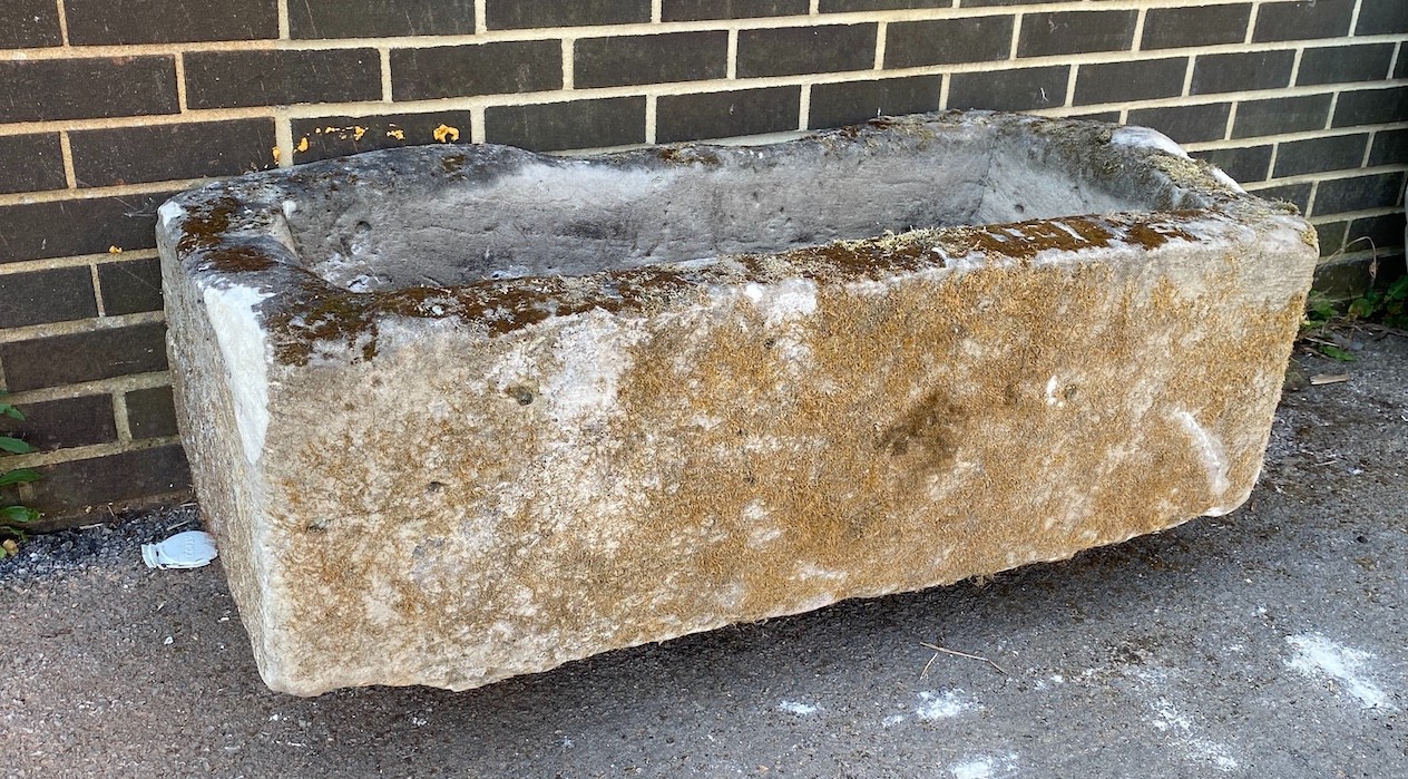 A large rectangular stone trough, length 117cm, depth 61cm, height 36cm